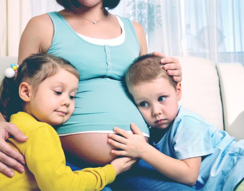 pregnant woman with two kids