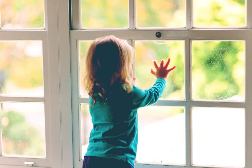kid looking at window
