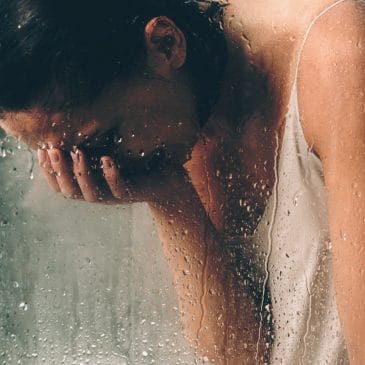 woman cry in the shower