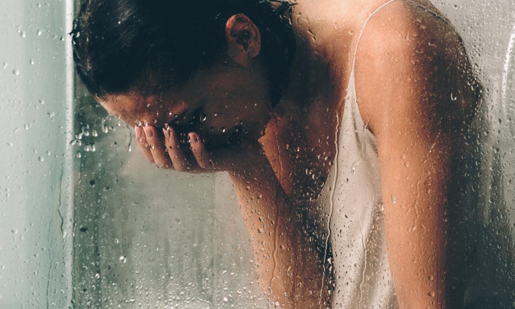 woman cry in the shower