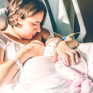 mother breastfeed newborn