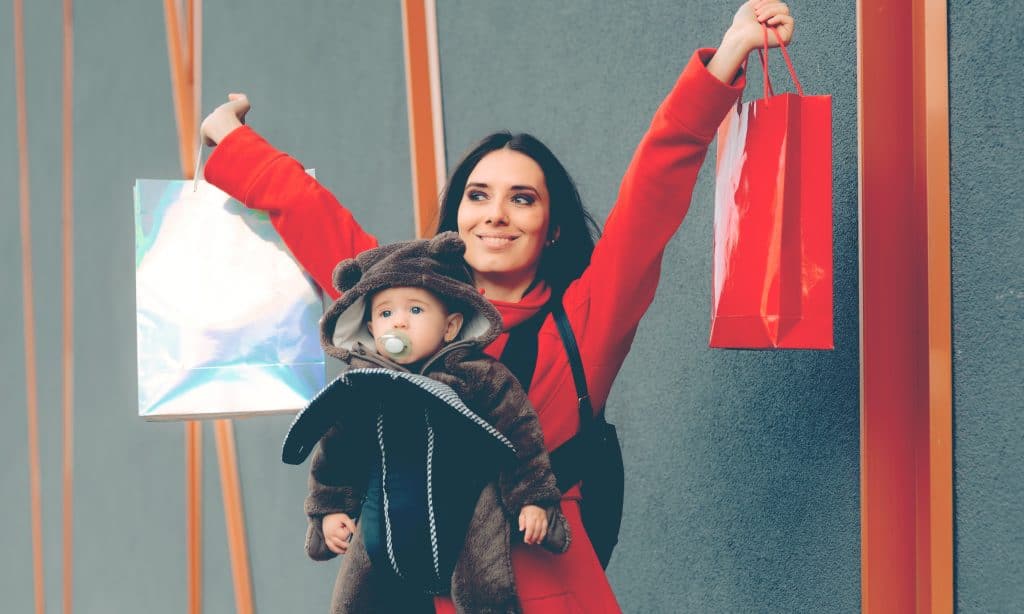 happy mother shopping with baby