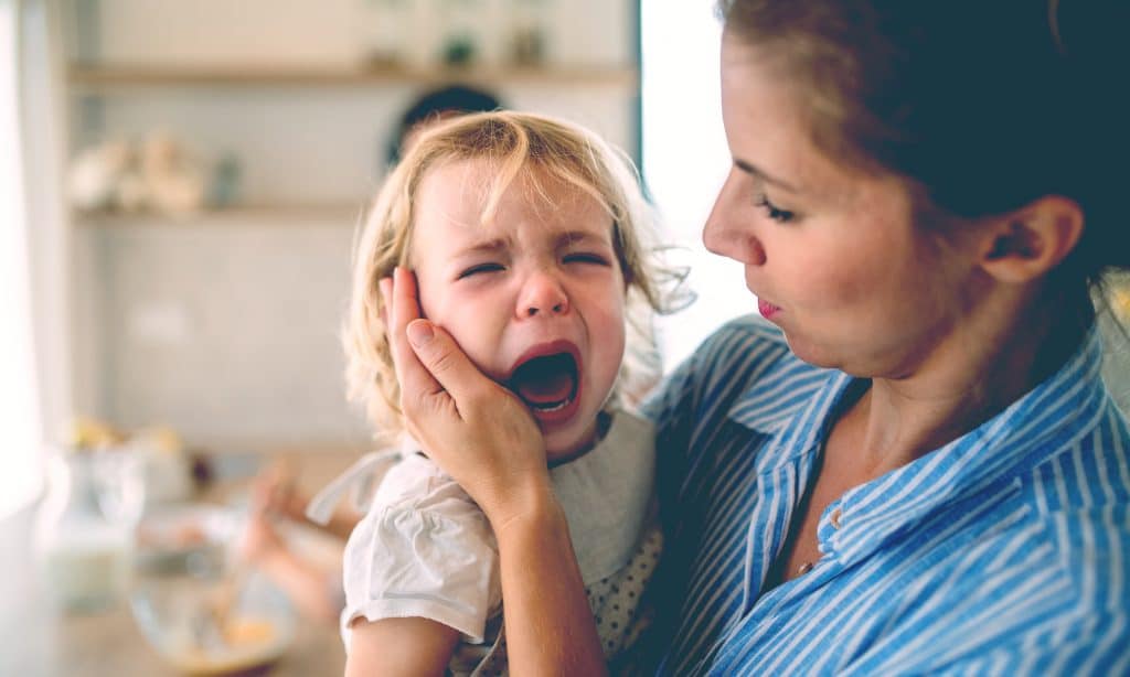 mother with daughter crying
