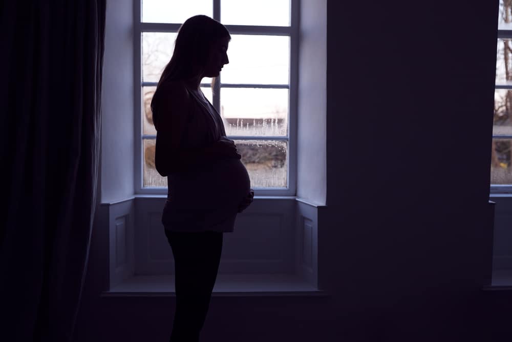 pregnant woman in the dark