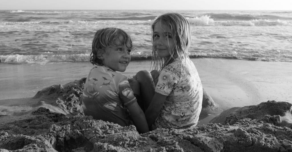 brother and sister on the beach