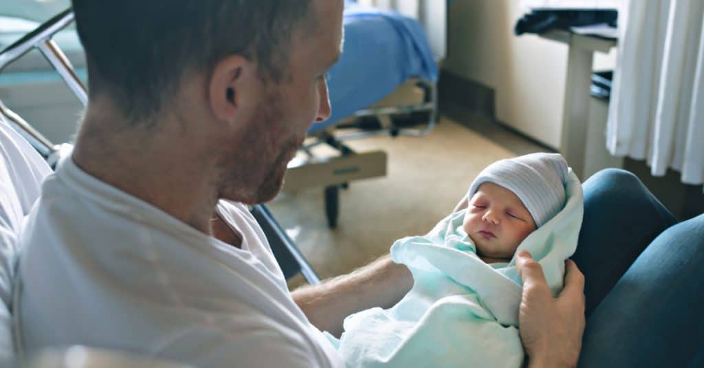 father with newborn at hospital